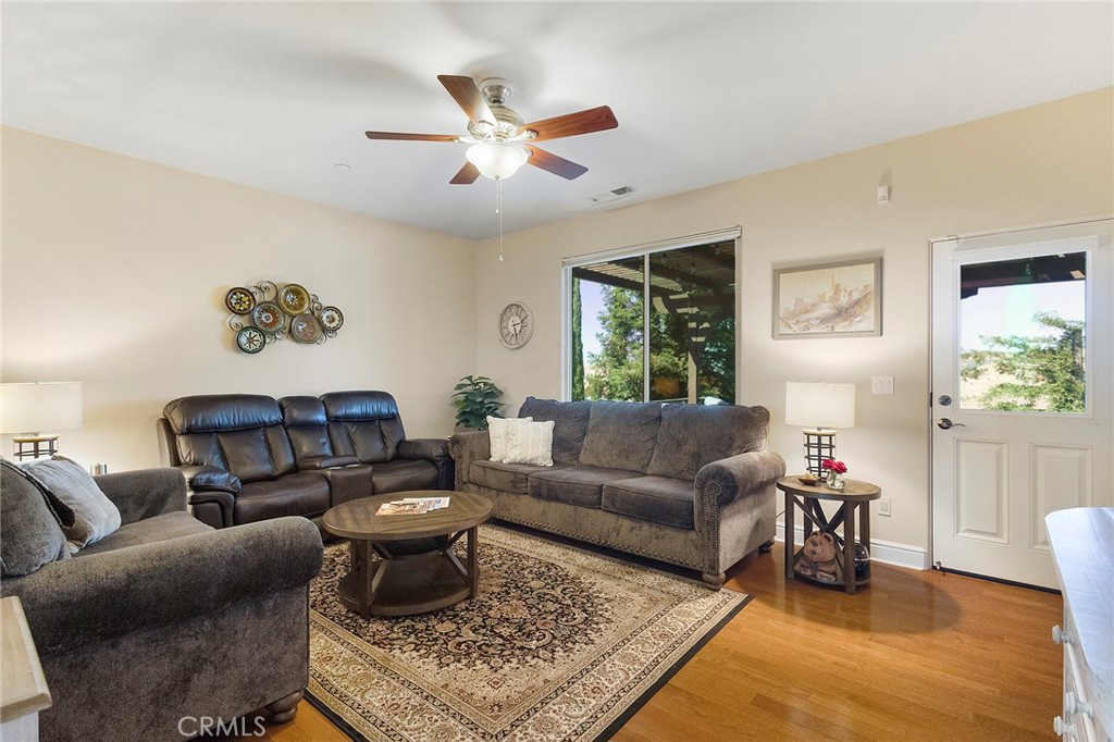 3294 Summit Ridge Terrace Chico, CA 95928 - Photo 41 of 68 a living room with furniture and a chandelier