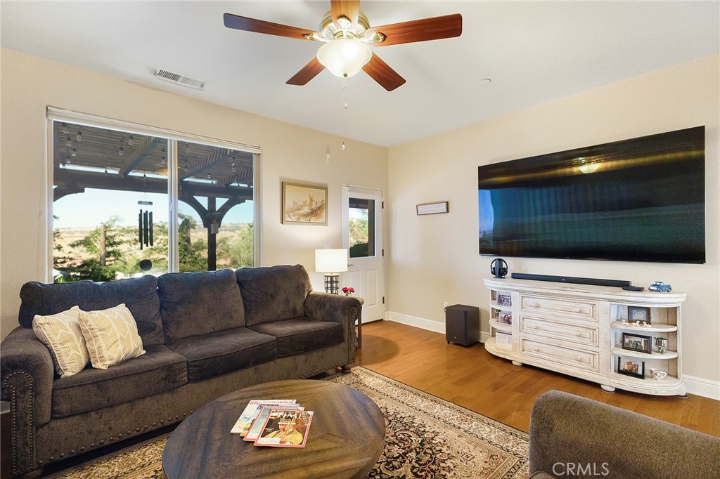 3294 Summit Ridge Terrace Chico, CA 95928 - Photo 43 of 68 a living room with furniture and a flat screen tv