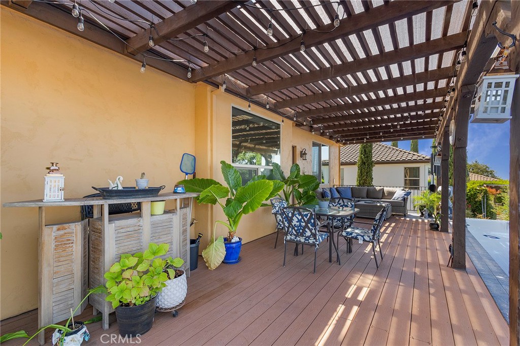 3294 Summit Ridge Terrace Chico, CA 95928 - Photo 49 of 68 a dining room with furniture potted plants and wooden floor