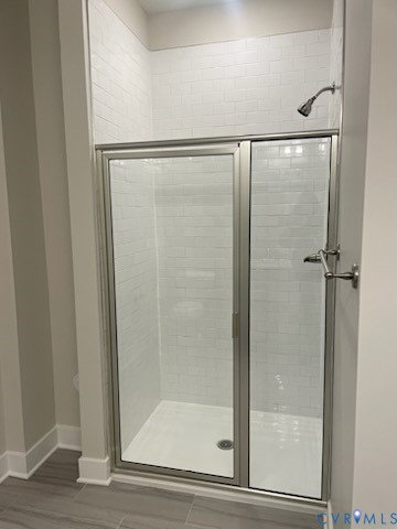 10525 Stony Blf Drive, Unit 202 Ashland, VA 23005 - Photo 10 of 30 Bathroom featuring a stall shower and light wood-t