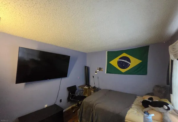 a bedroom with furniture and a lamp