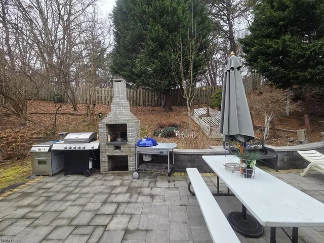 a view of a backyard with sitting area