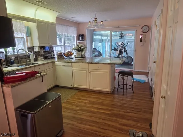 a kitchen with sink and cabinets