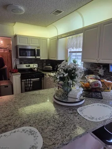 a kitchen with a sink and a stove