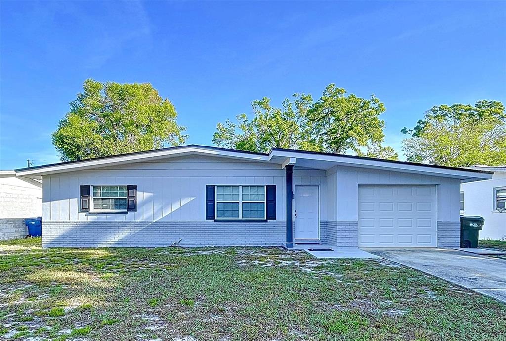 910 Lakeside Drive Largo, FL 33778 - Photo 1 of 1 front view of a house with a yard