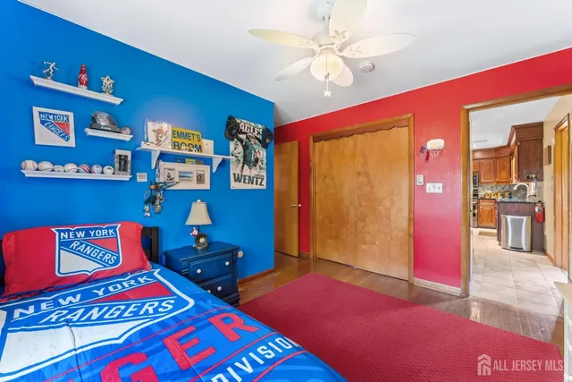 a bedroom with a bed and dresser