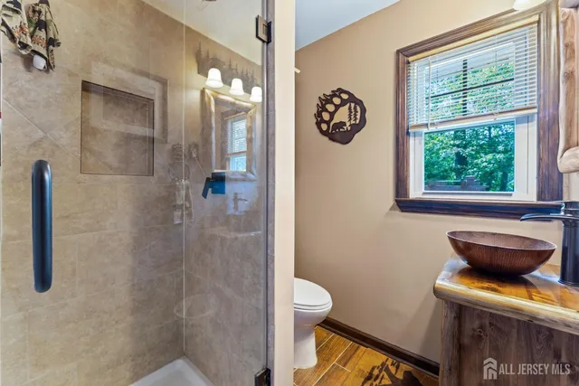 a kitchen with stainless steel appliances kitchen island granite countertop a sink and cabinets