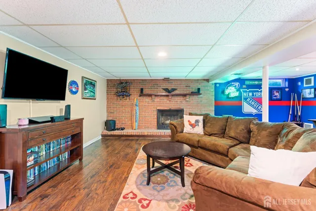 a room with furniture and pool table
