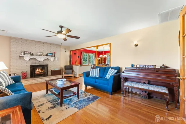 a living room with furniture a rug and a fireplace