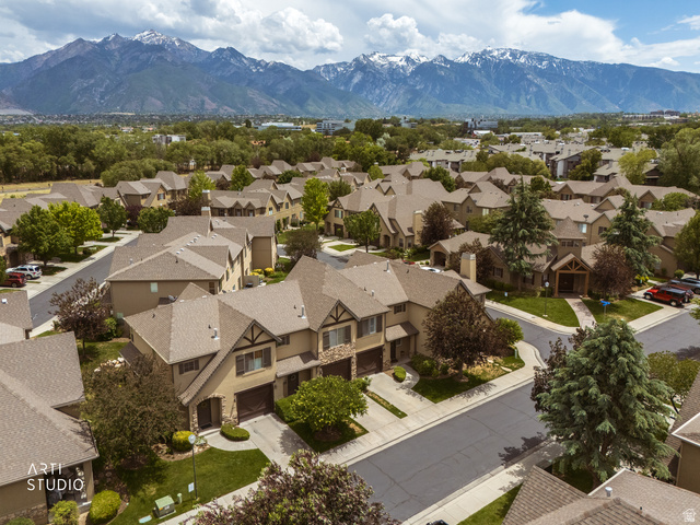 6761 950 East Midvale, UT 84047 - Photo 39 of 44 Community of residences featuring pitched roofs and a mountainous backdrop
