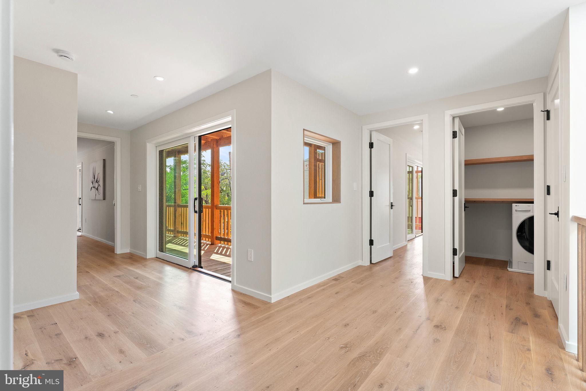 21 Overbeck Alley Northeast Washington, DC 20002 - Photo 24 of 63 a view of a big room with wooden floor and a window