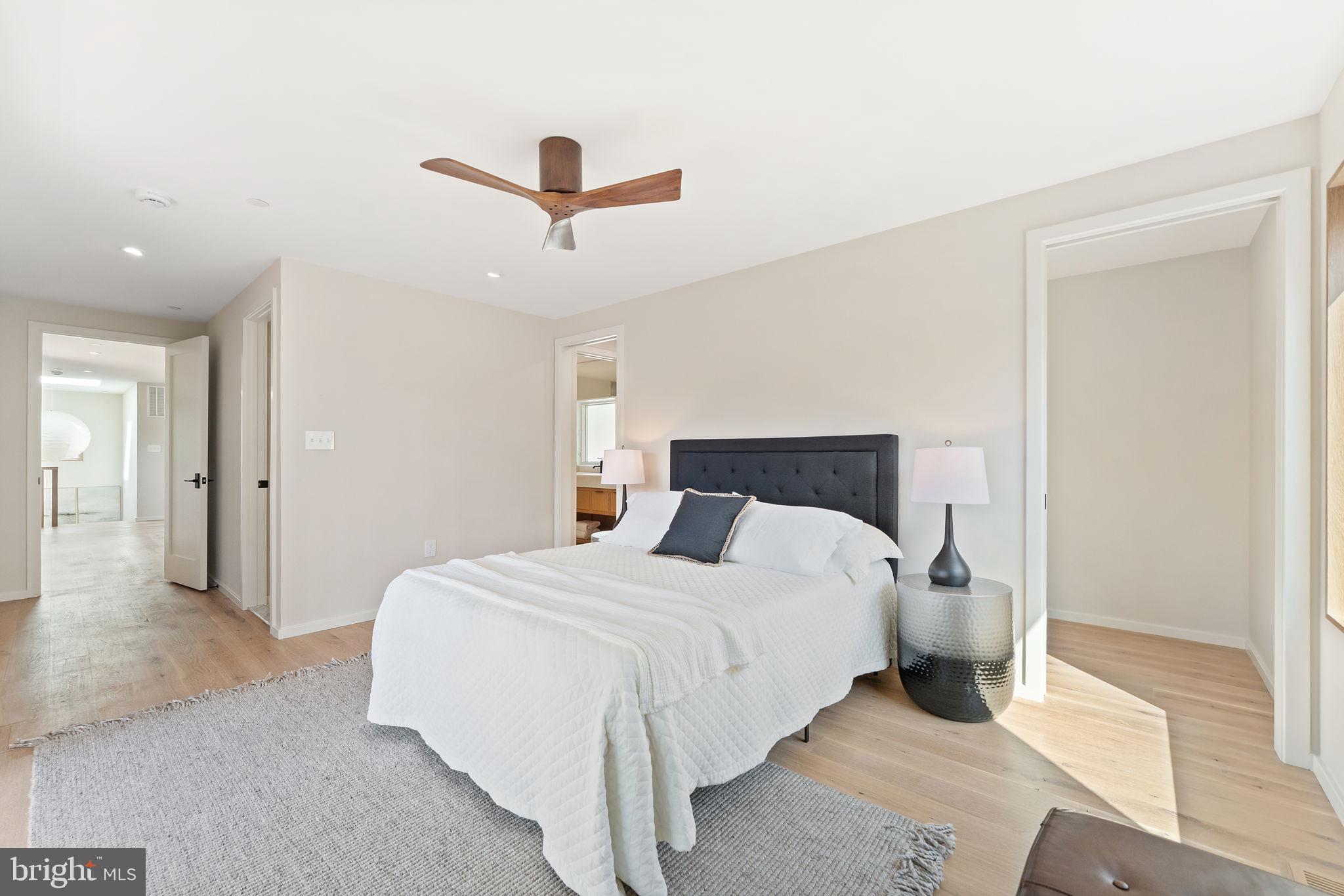 21 Overbeck Alley Northeast Washington, DC 20002 - Photo 27 of 63 a bedroom with a bed and a ceiling fan