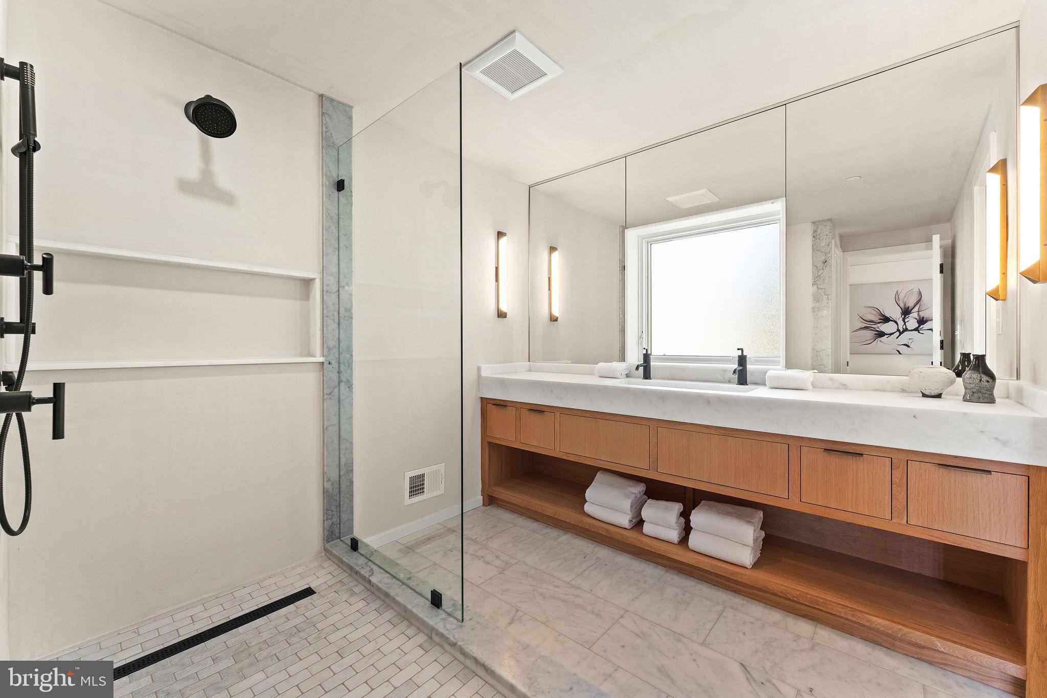 21 Overbeck Alley Northeast Washington, DC 20002 - Photo 33 of 63 a bathroom with a sink and a mirror