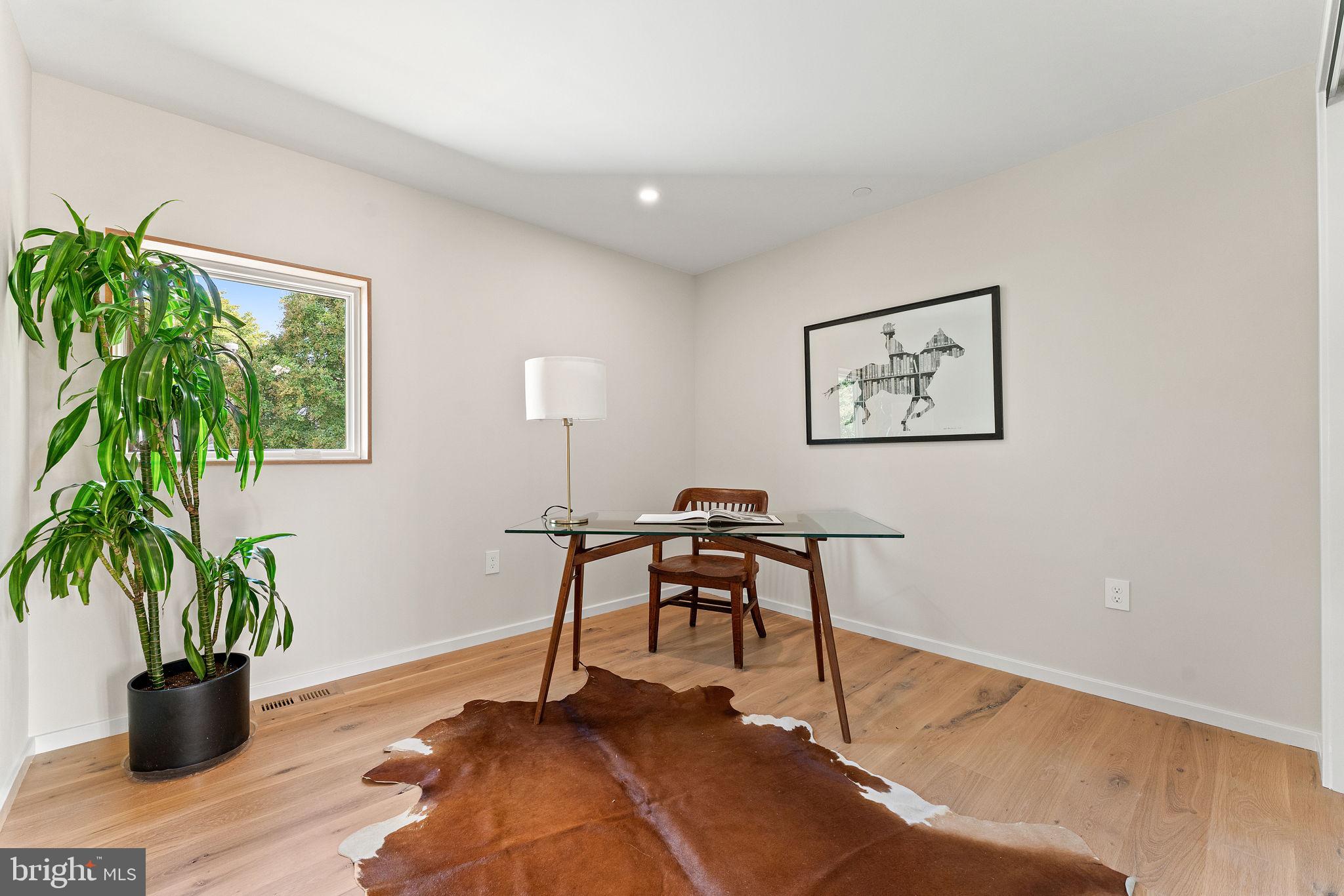21 Overbeck Alley Northeast Washington, DC 20002 - Photo 43 of 63 a view of a workspace with furniture and a potted plant