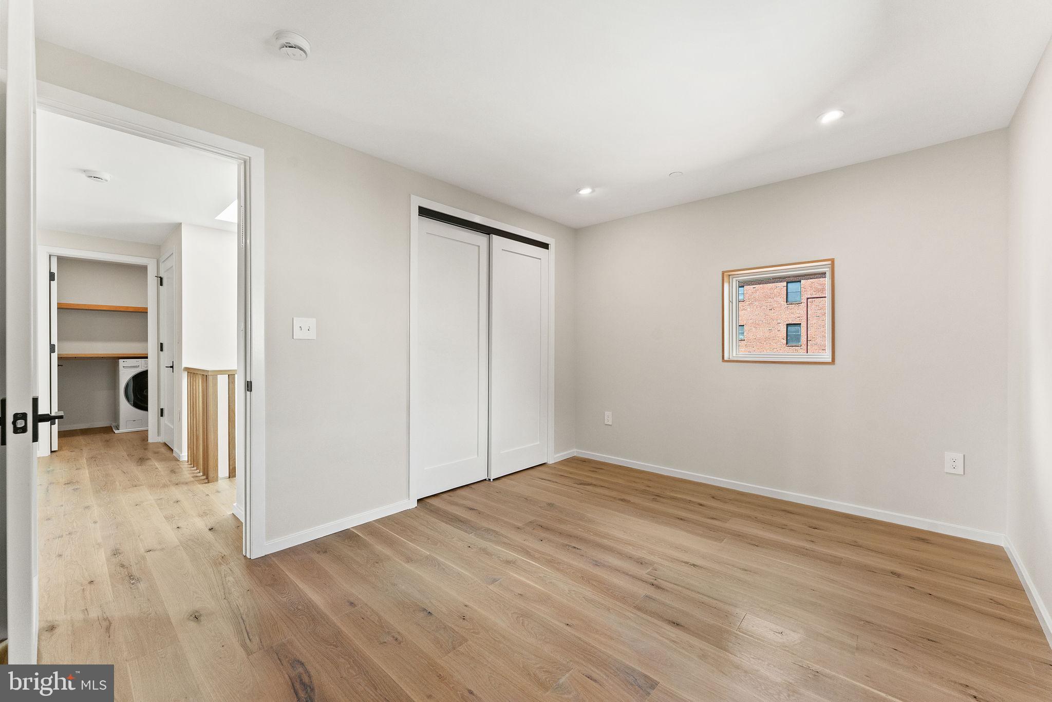 21 Overbeck Alley Northeast Washington, DC 20002 - Photo 46 of 63 a view of a big room with wooden floor and a bathroom