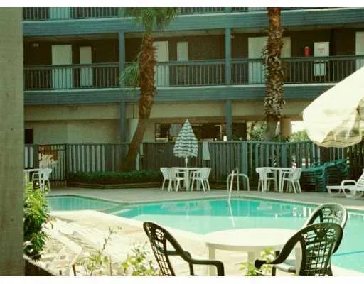 a view of a chair and table in the balcony