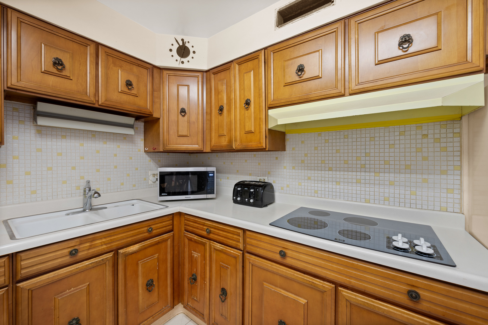 5855 North Sheridan Road, Unit 10G Chicago, IL 60660 - Photo 12 of 31 a kitchen with stainless steel appliances granite countertop a sink a stove cabinets and utility