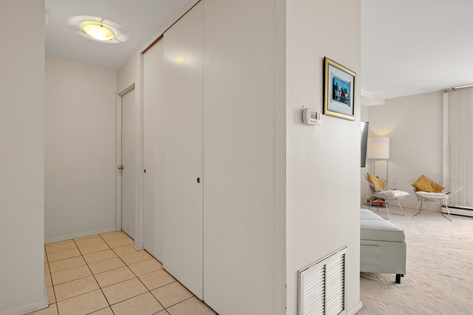 5855 North Sheridan Road, Unit 10G Chicago, IL 60660 - Photo 19 of 31 a view of kitchen with livingroom and couch