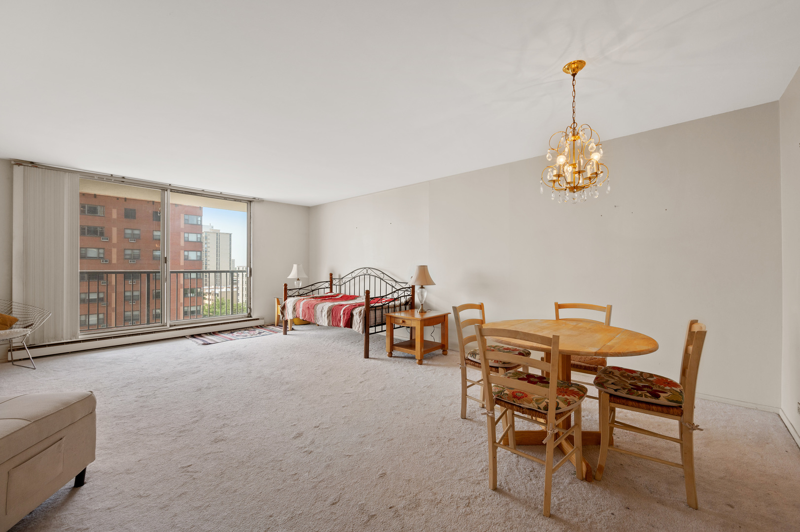5855 North Sheridan Road, Unit 10G Chicago, IL 60660 - Photo 2 of 31 a view of a livingroom with furniture and a window
