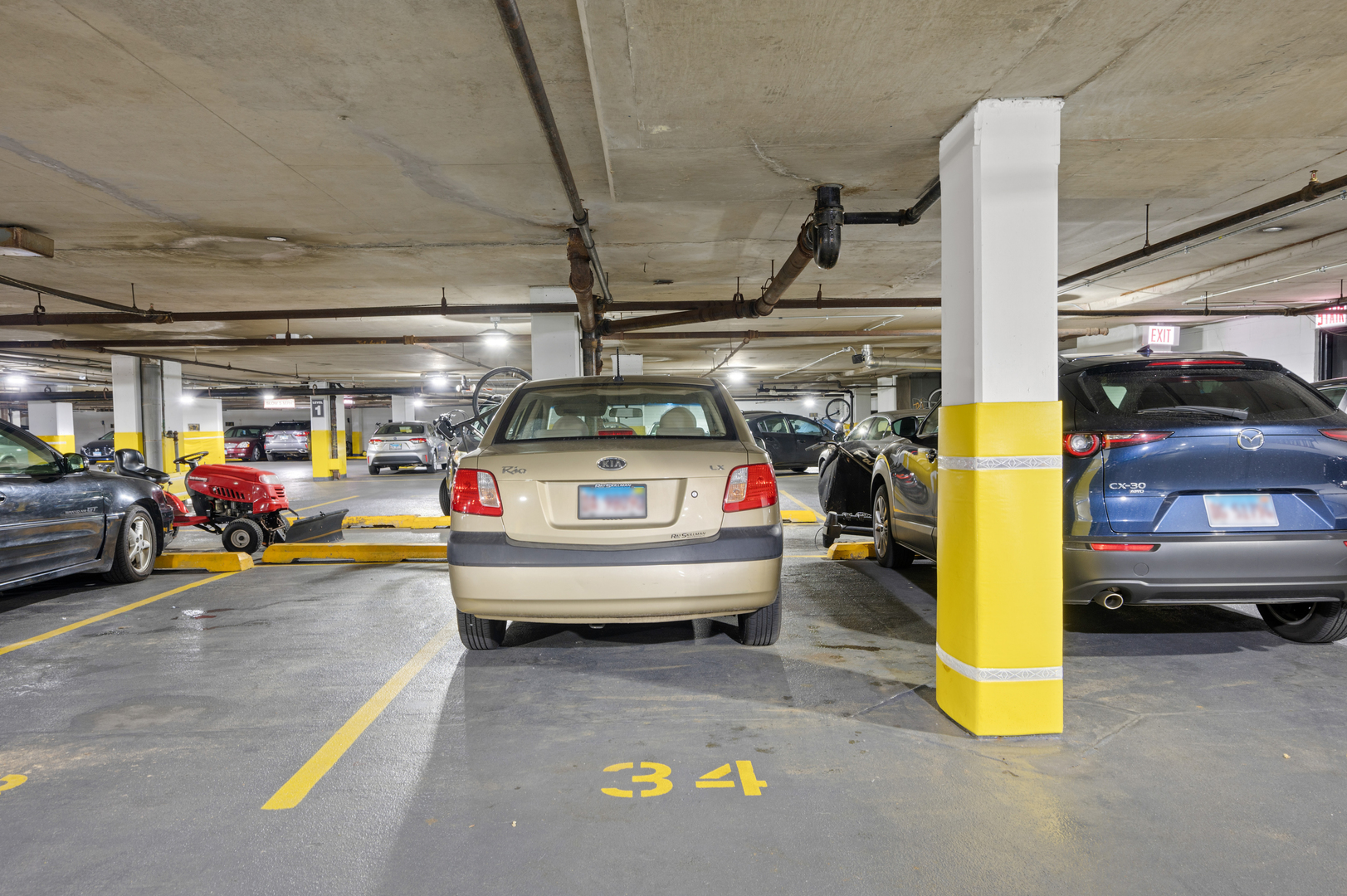 5855 North Sheridan Road, Unit 10G Chicago, IL 60660 - Photo 27 of 31 a view of parking garage with cars and parked