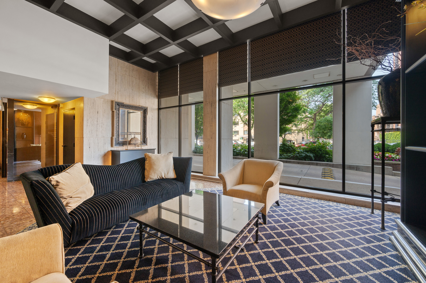 5855 North Sheridan Road, Unit 10G Chicago, IL 60660 - Photo 29 of 31 a living room with furniture and a floor to ceiling window