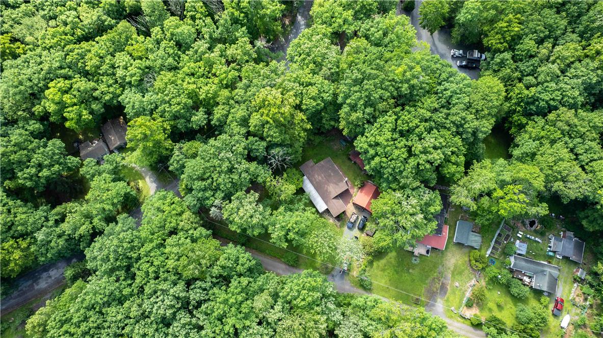 8 Cross Rds Drive Jim Thorpe, PA 18229 - Photo 29 of 32 An aerial perspective reveals a secluded property nestled within a lush canopy.