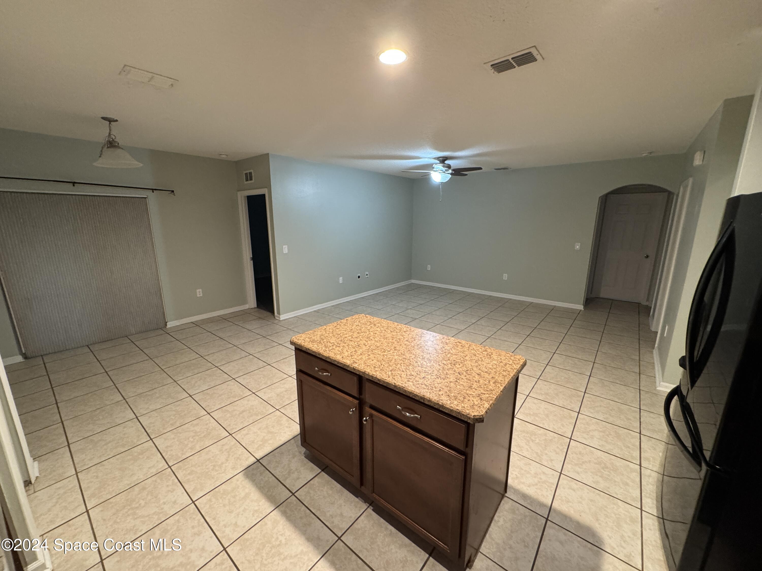 5281 Talbot Boulevard Cocoa, FL 32926 - Photo 11 of 31 a kitchen with stainless steel appliances granite countertop a sink and a stove
