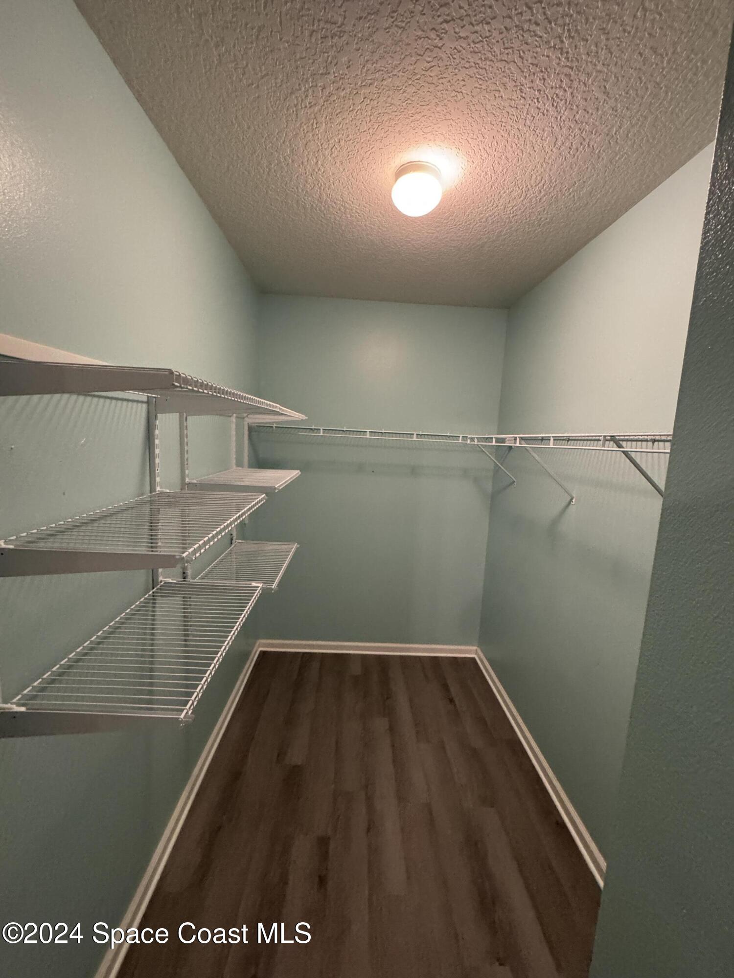 5281 Talbot Boulevard Cocoa, FL 32926 - Photo 16 of 31 a view of a room with racks on the wall