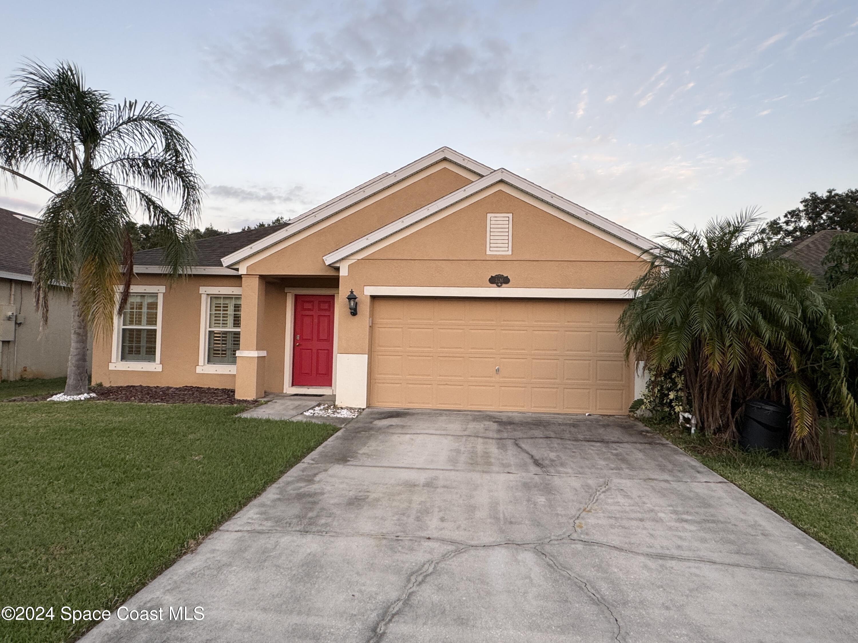 5281 Talbot Boulevard Cocoa, FL 32926 - Photo 2 of 31 front view of a house with a yard