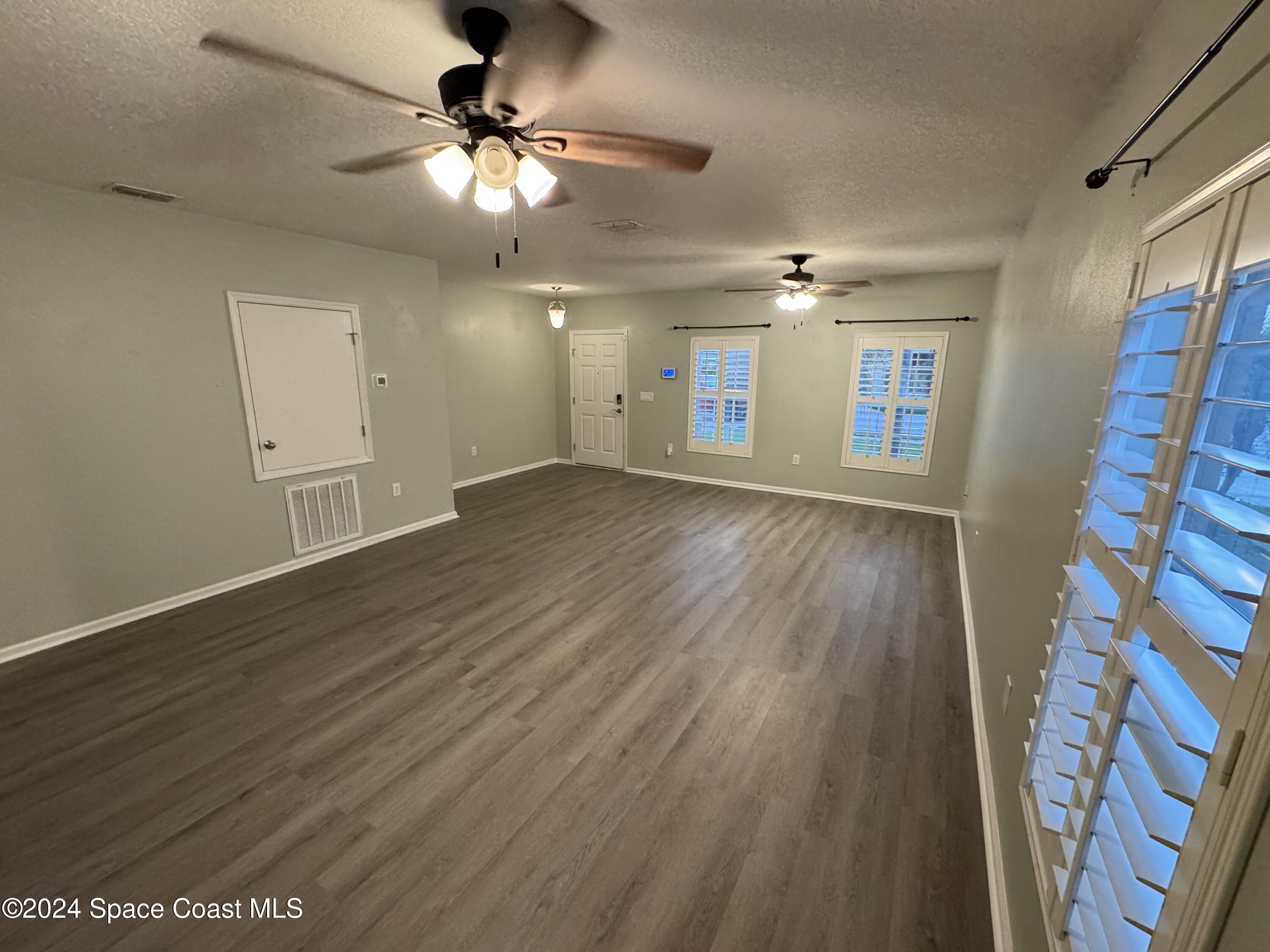 5281 Talbot Boulevard Cocoa, FL 32926 - Photo 5 of 31 a view of an empty room with a window