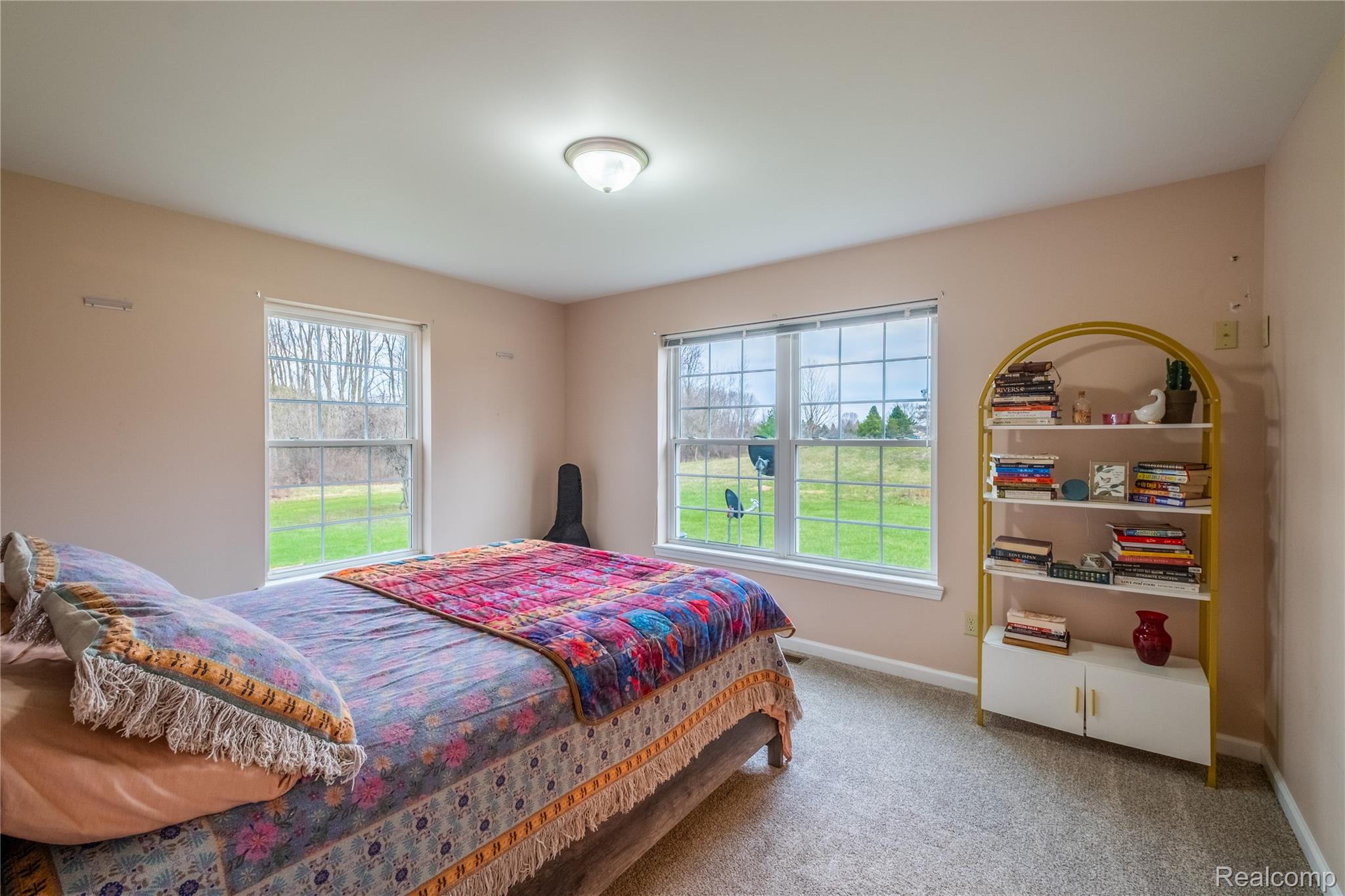 4210 Evans Road Holly, MI 48442 - Photo 3 of 23 Bedroom featuring light colored carpet and multiple windows