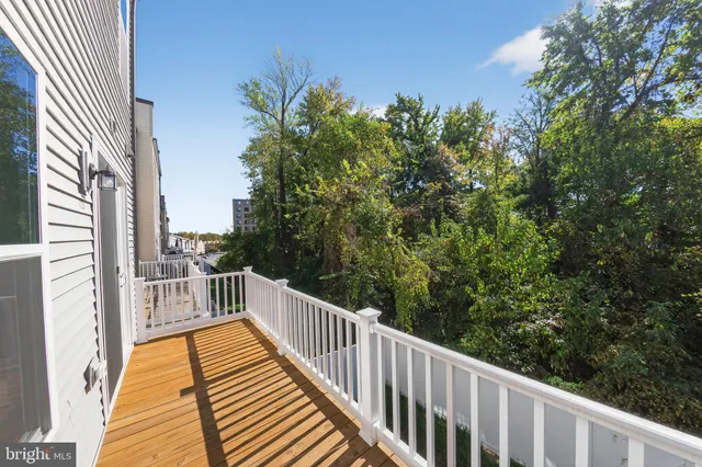 a view of a balcony with wooden floor
