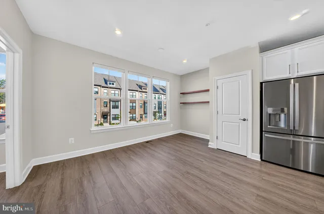 a dining room with furniture a wooden floor and a chandelier