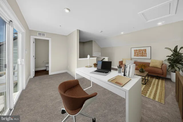a white toilet sitting next to a bathroom sink