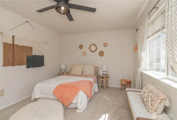 a bedroom with a bed and window