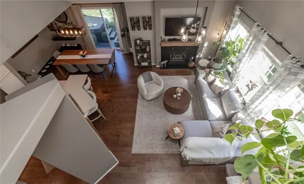 a view of living room with furniture and a fireplace