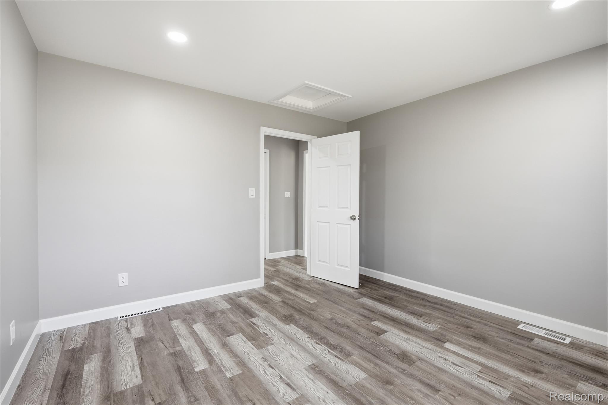 8636 Tindall Road Davisburg, MI 48350 - Photo 24 of 61 Spare room featuring light wood-style flooring and recessed lighting