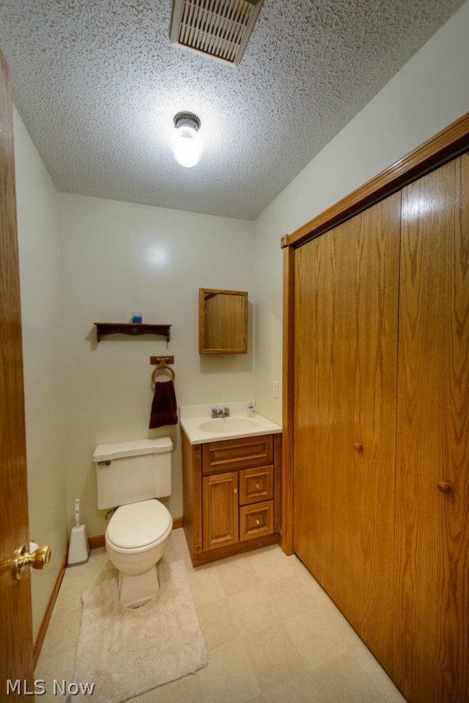 24797 Ridge Road East Rochester, OH 44625 - Photo 17 of 20 Half bath on main floor with area for 1st floor laundry