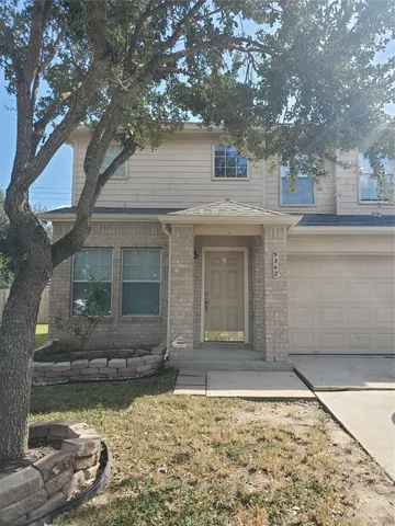 view of a house with a yard