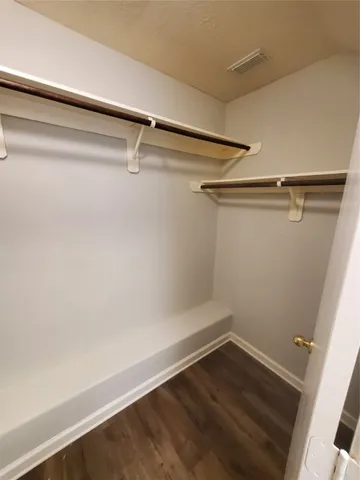 a view of a room with racks on the wall