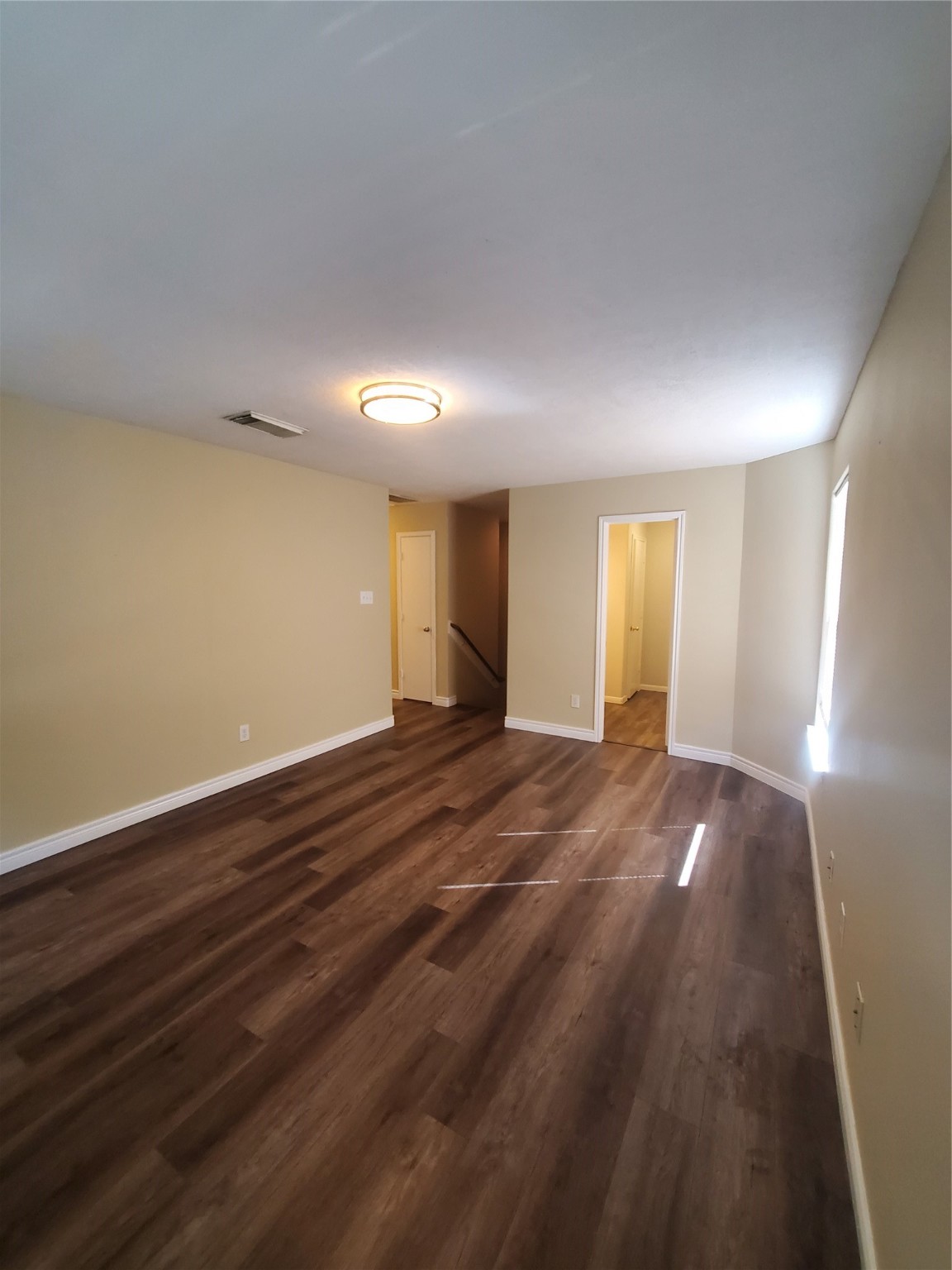 9342 Canady Park Lane Houston, TX 77075 - Photo 19 of 25 a view of an empty room with window and wooden floor
