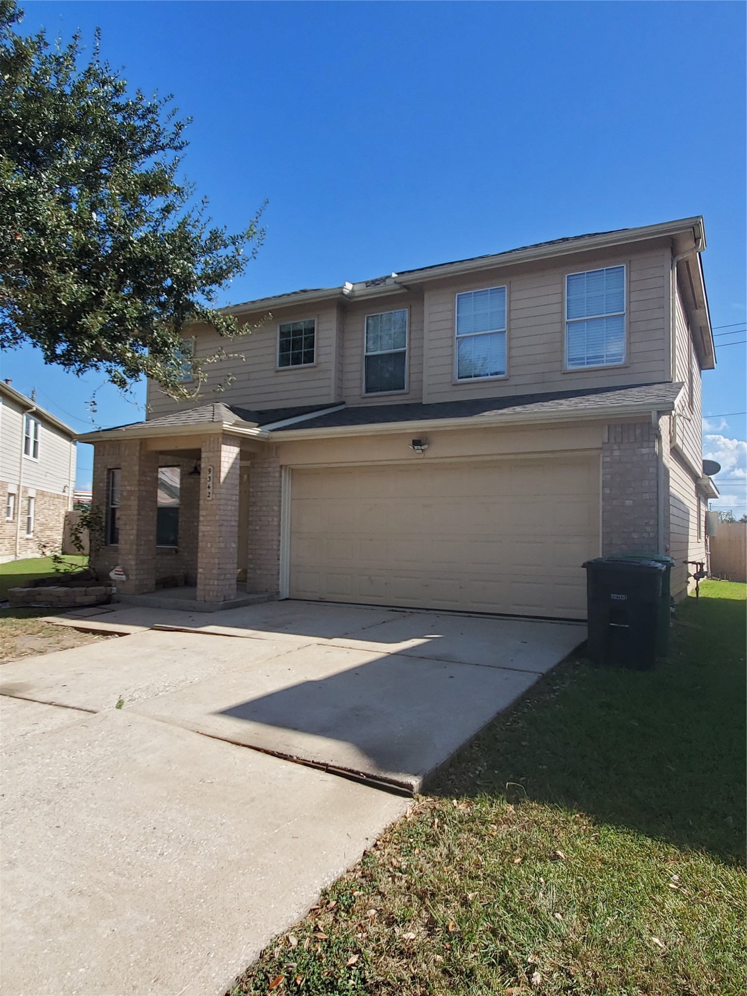 9342 Canady Park Lane Houston, TX 77075 - Photo 2 of 25 a front view of a house with a yard