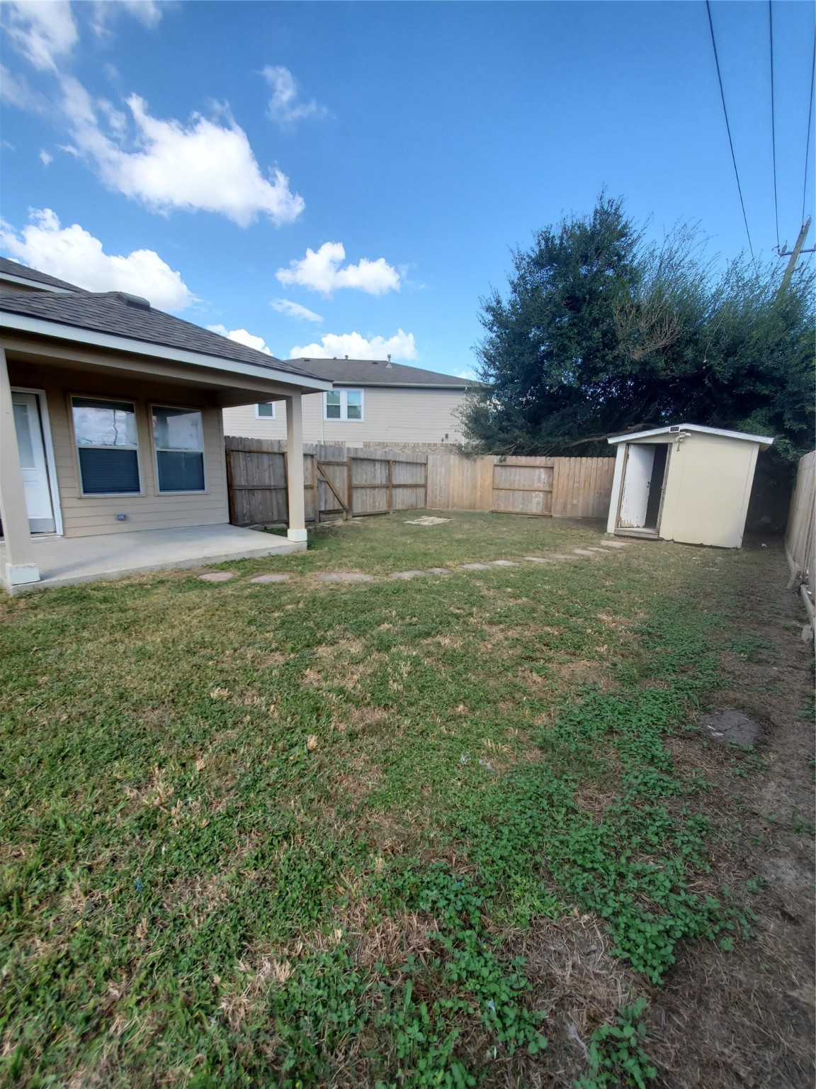 9342 Canady Park Lane Houston, TX 77075 - Photo 25 of 25 a view of a house with a yard