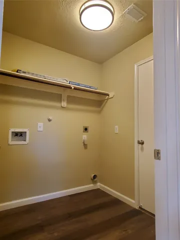 a view of a small space with wooden floor