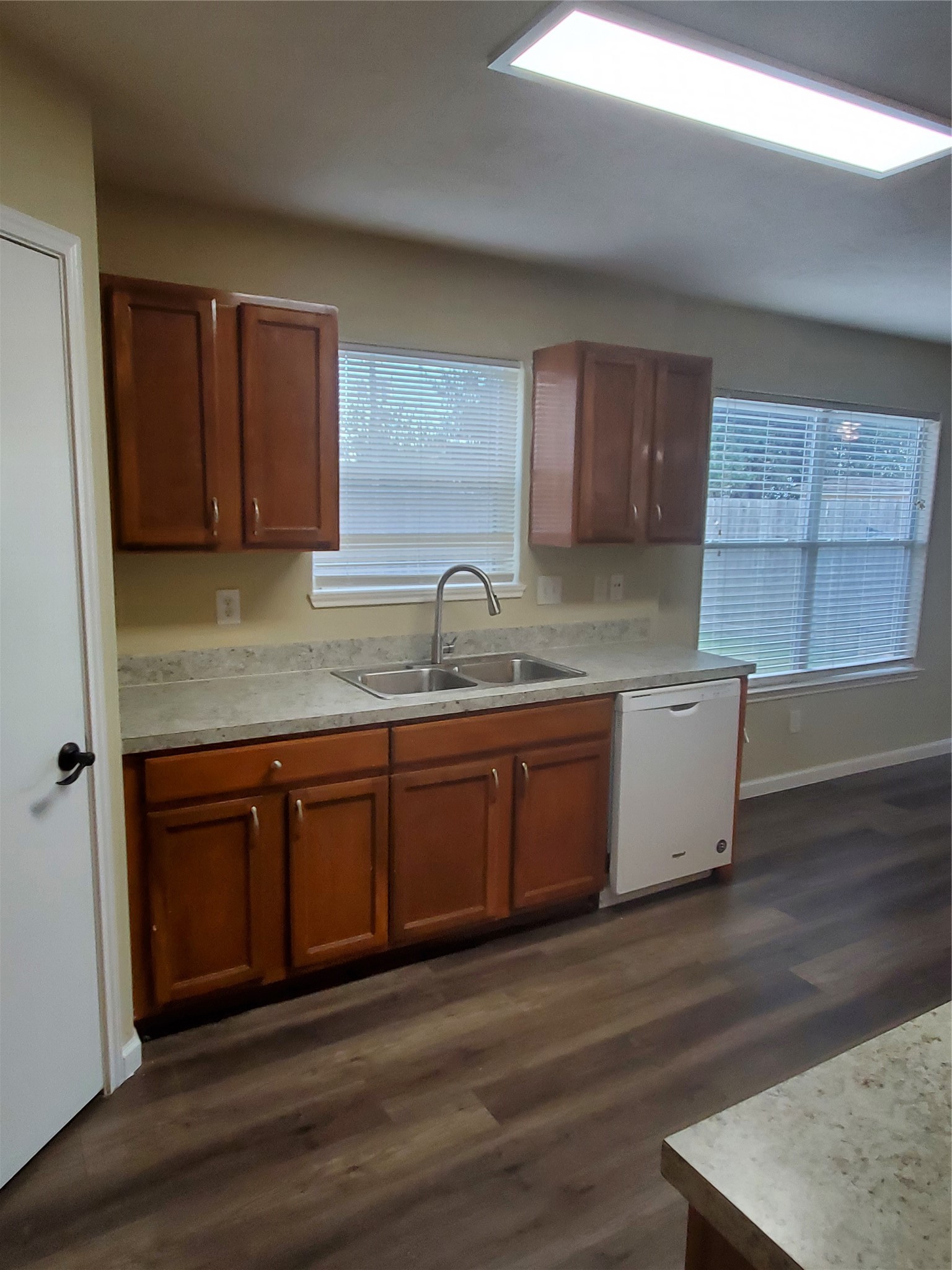 9342 Canady Park Lane Houston, TX 77075 - Photo 7 of 25 a kitchen with granite countertop wooden cabinets a sink and dishwasher