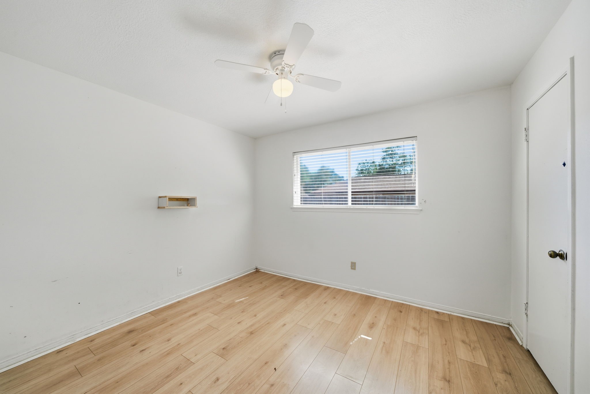 6919 River Mill Drive Spring, TX 77379 - Photo 12 of 20 wooden floor in an empty room with a window
