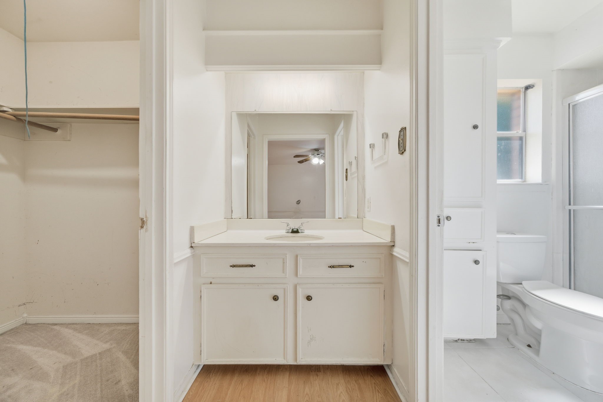 6919 River Mill Drive Spring, TX 77379 - Photo 15 of 20 a bathroom with a granite countertop sink mirror and a toilet