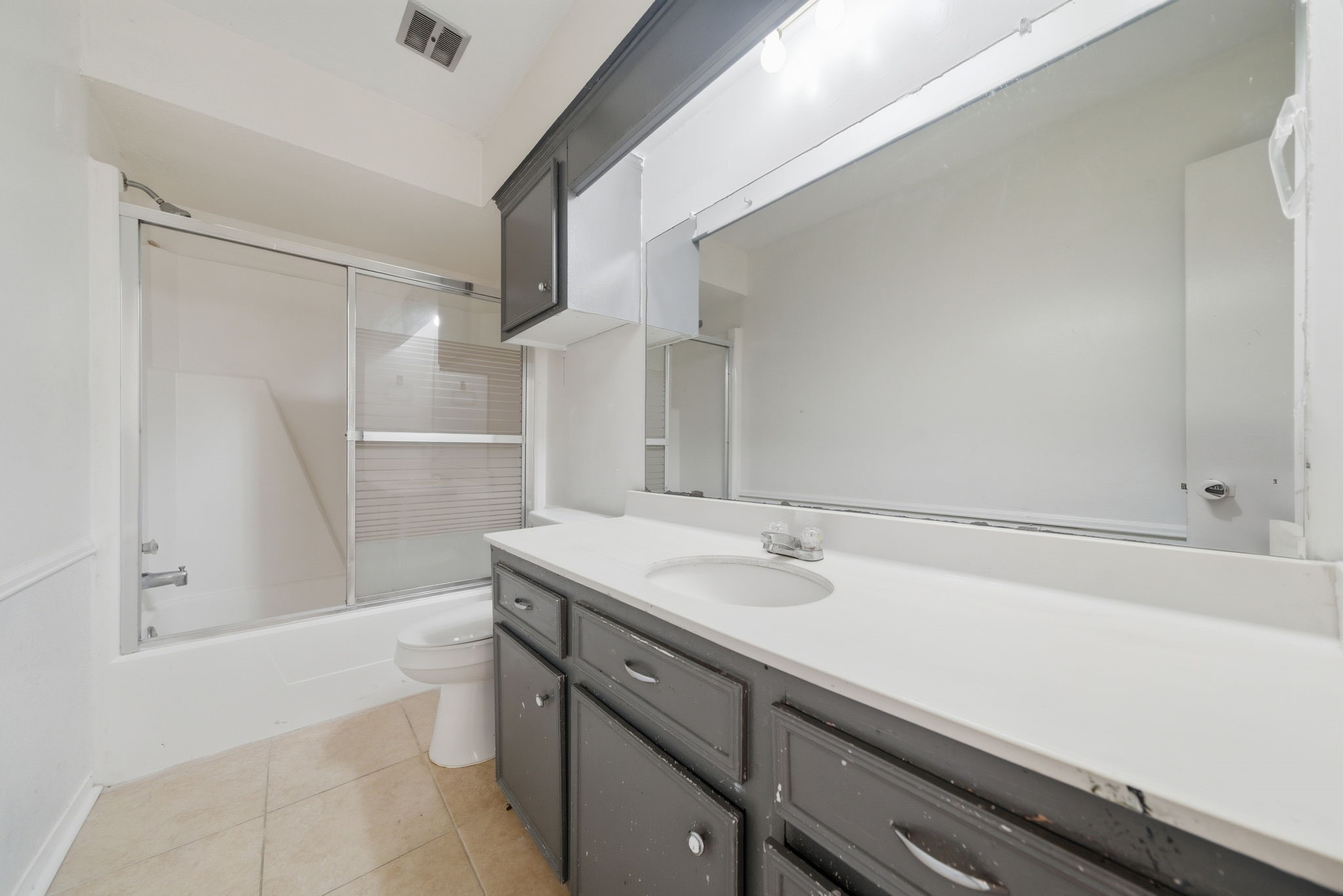 6919 River Mill Drive Spring, TX 77379 - Photo 4 of 20 a bathroom with a sink a toilet and shower