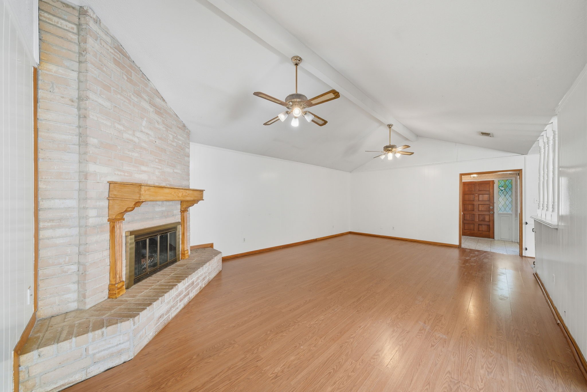 6919 River Mill Drive Spring, TX 77379 - Photo 8 of 20 wooden floor in an empty room with a fireplace