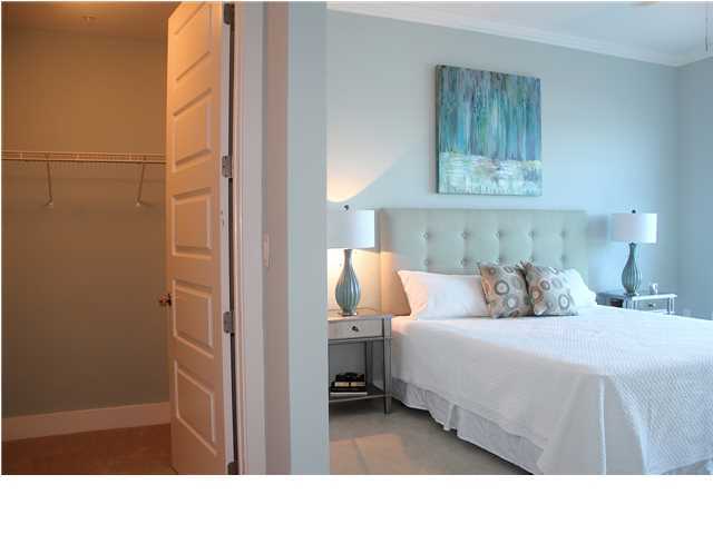211 Durango Road, Unit 213 Destin, FL 32541 - Photo 12 of 32 a bedroom with a bed and a lamp